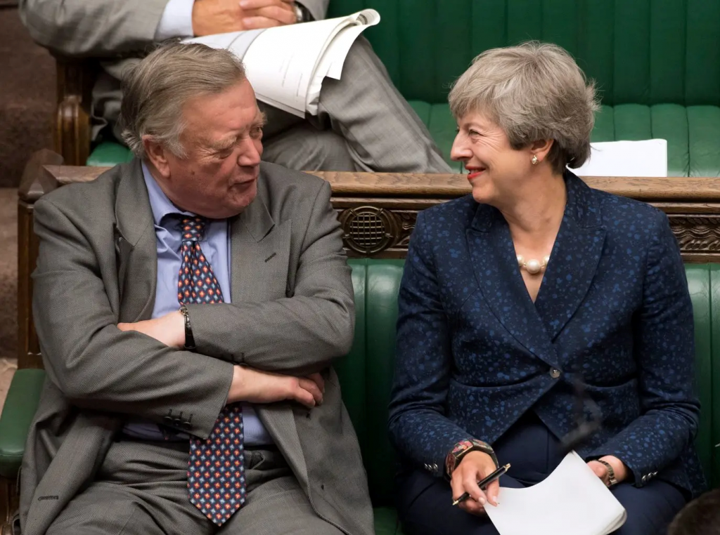 Theresa May in the House of Commons sitting next to Ken Clarke.